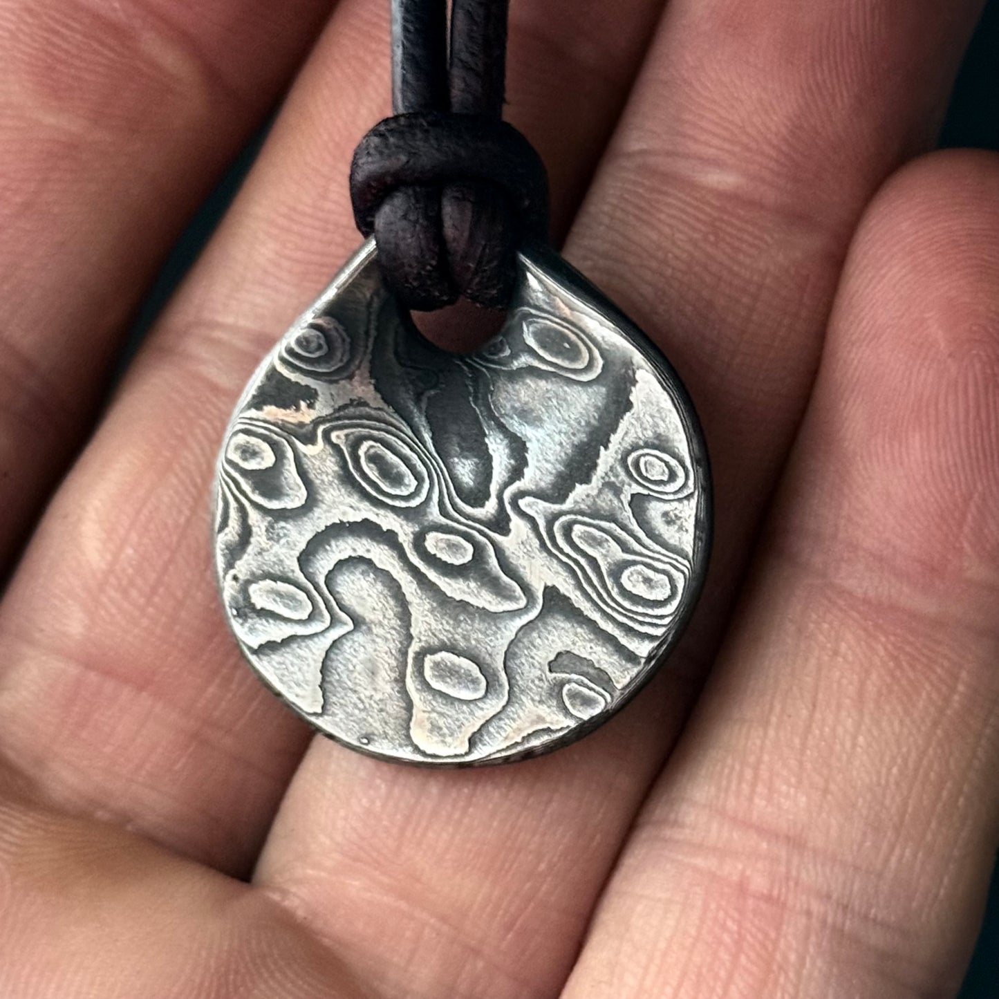Damascus PENDANT. Forged in Montana. Unique. Layered Steel. Rugged. Leather cord. Necklace. Gifts. For him. For her. Jewelry. Best seller
